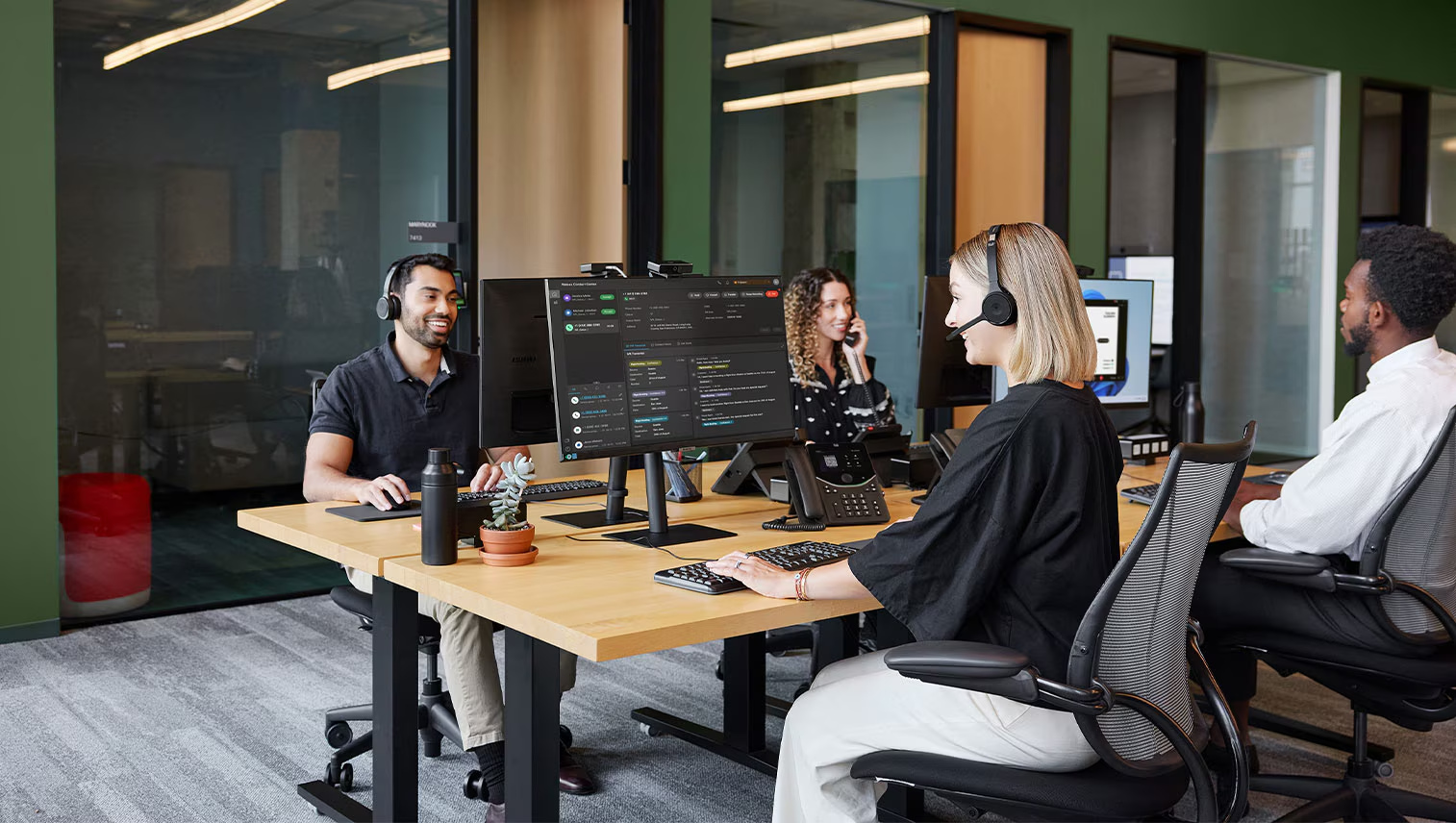 Contact center team using headsets and Webex collaboration tools
